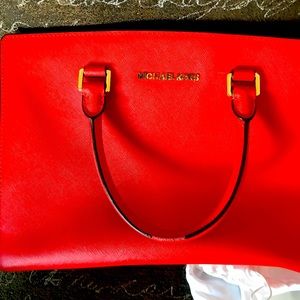 Tangerine Michael Kors tote bag.